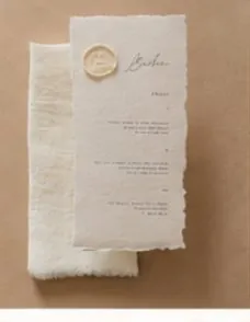A handmade paper menu sealed with wax